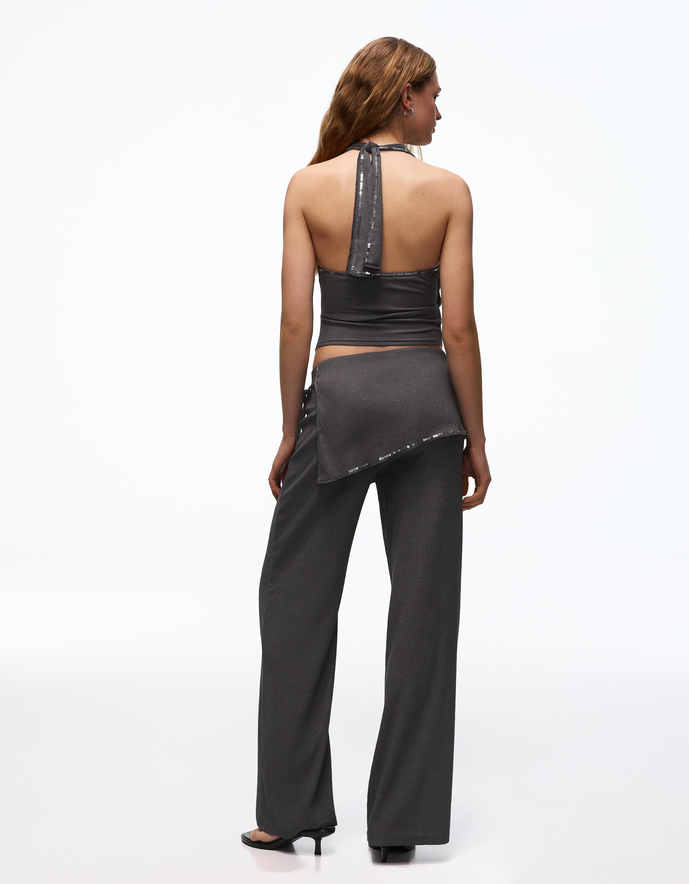 Trousers with sequin overskirt