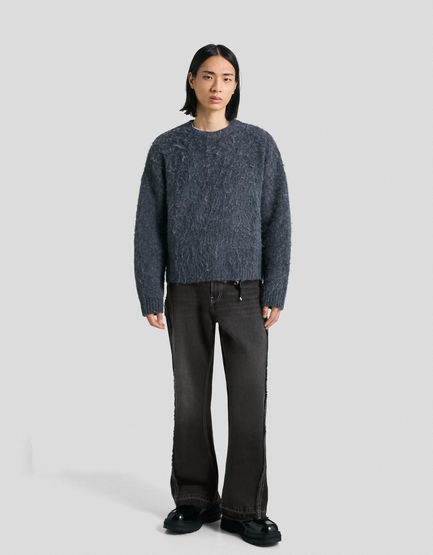 Jeans flare com franjas-Preto