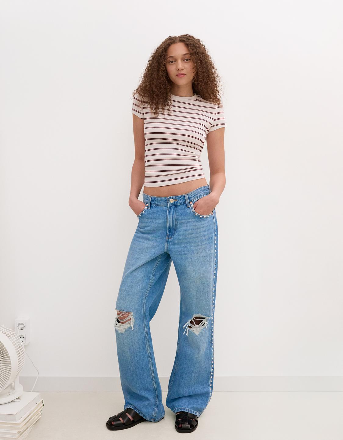 Ripped wide-leg jeans with studs