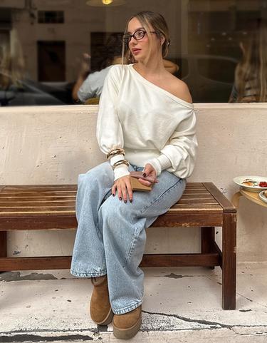 Asymmetric sweater with ribbed hem