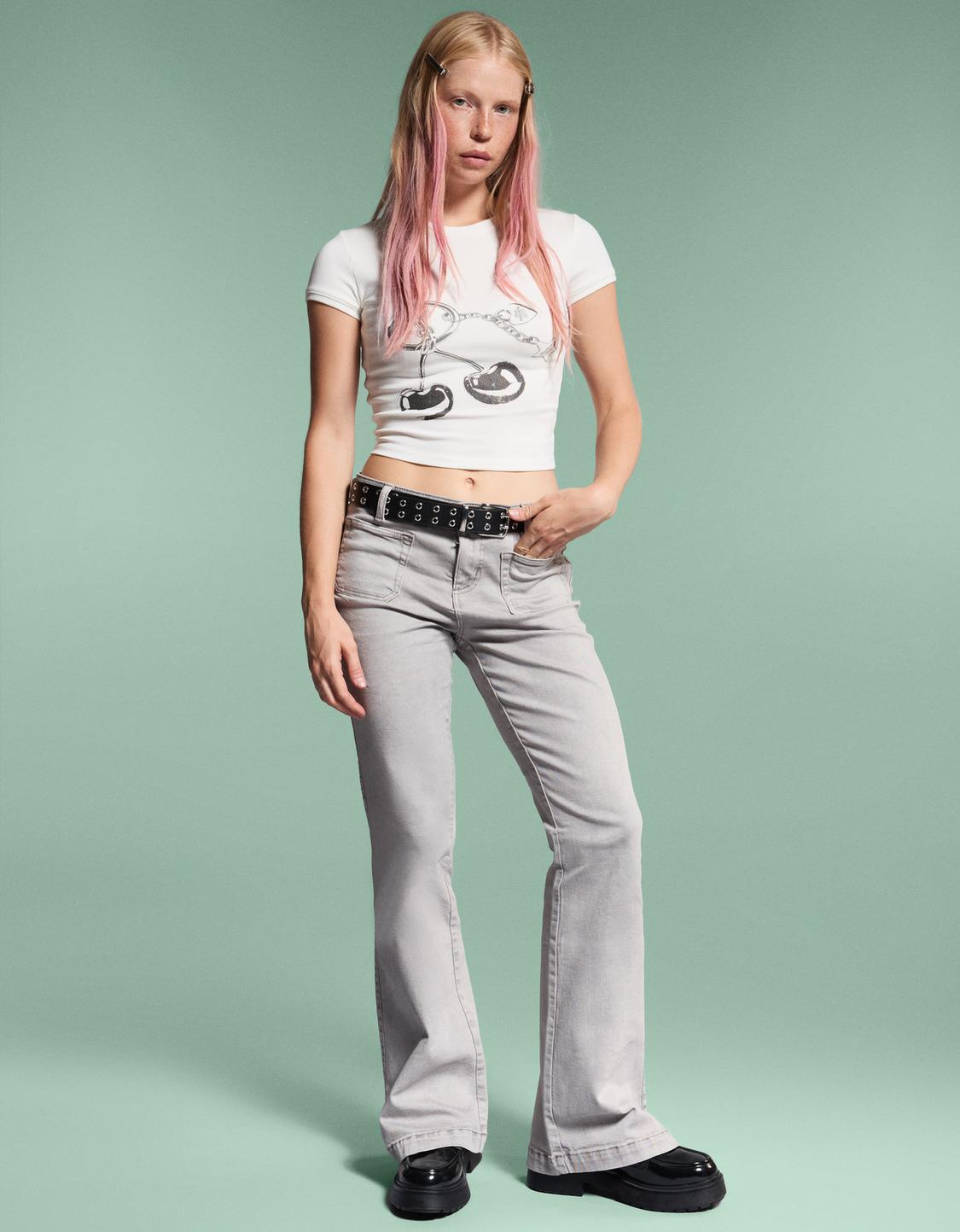 Flare trousers with flaps and pocket