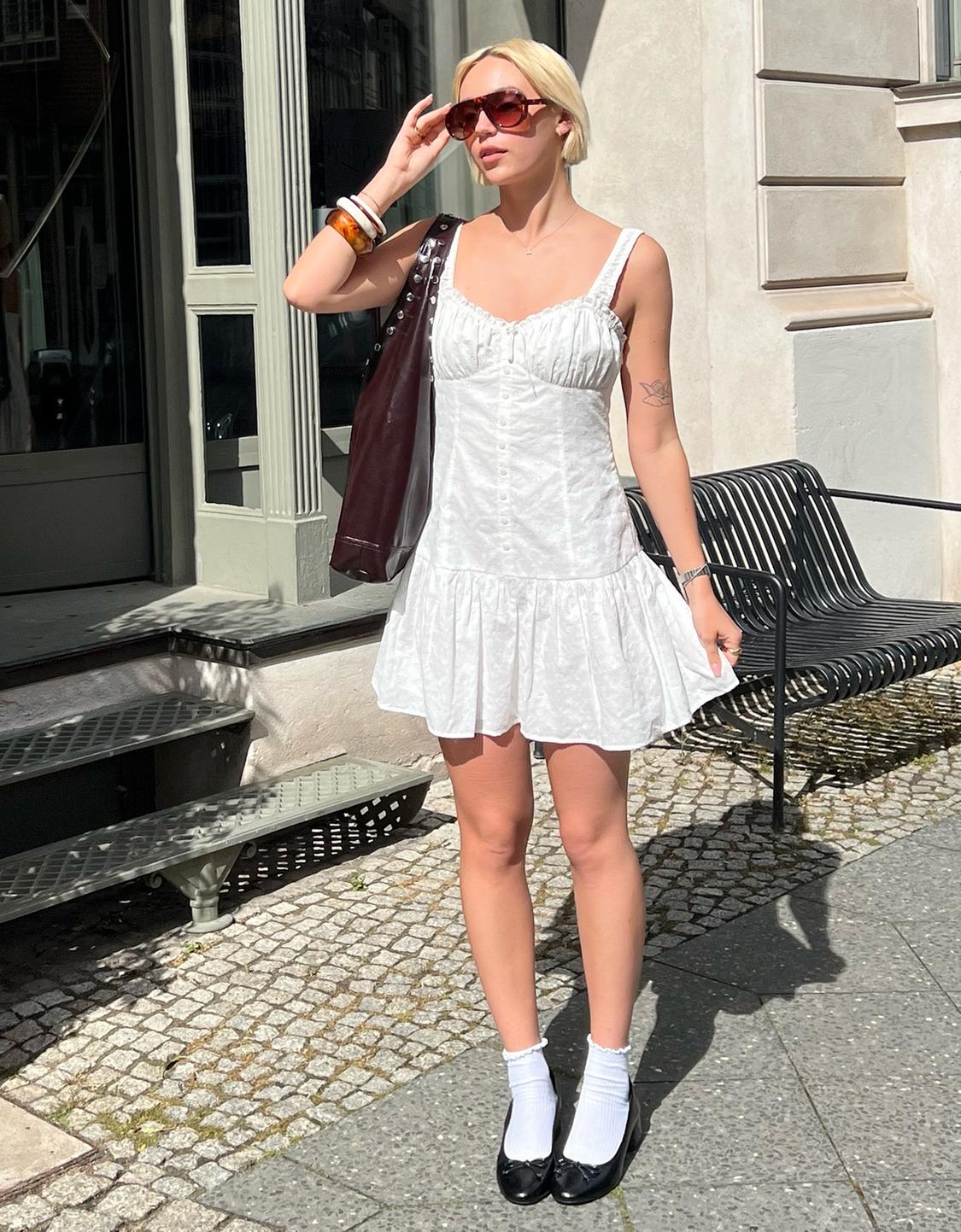 Fitted embroidered mini dress with flounce