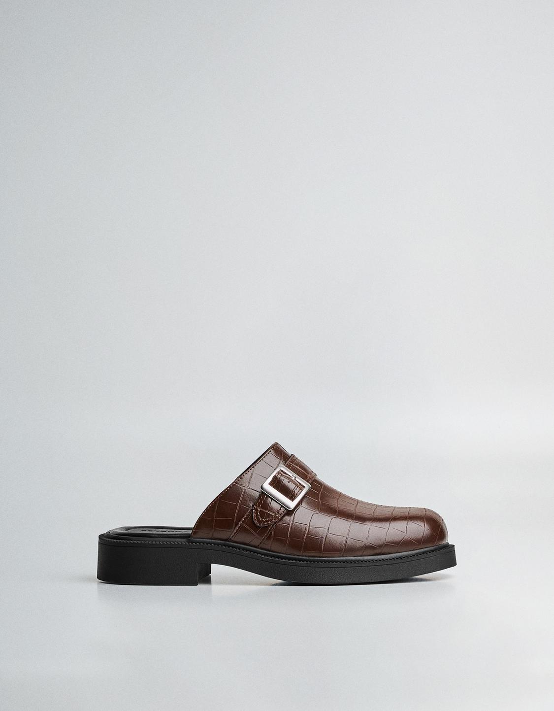 Buckled clogs