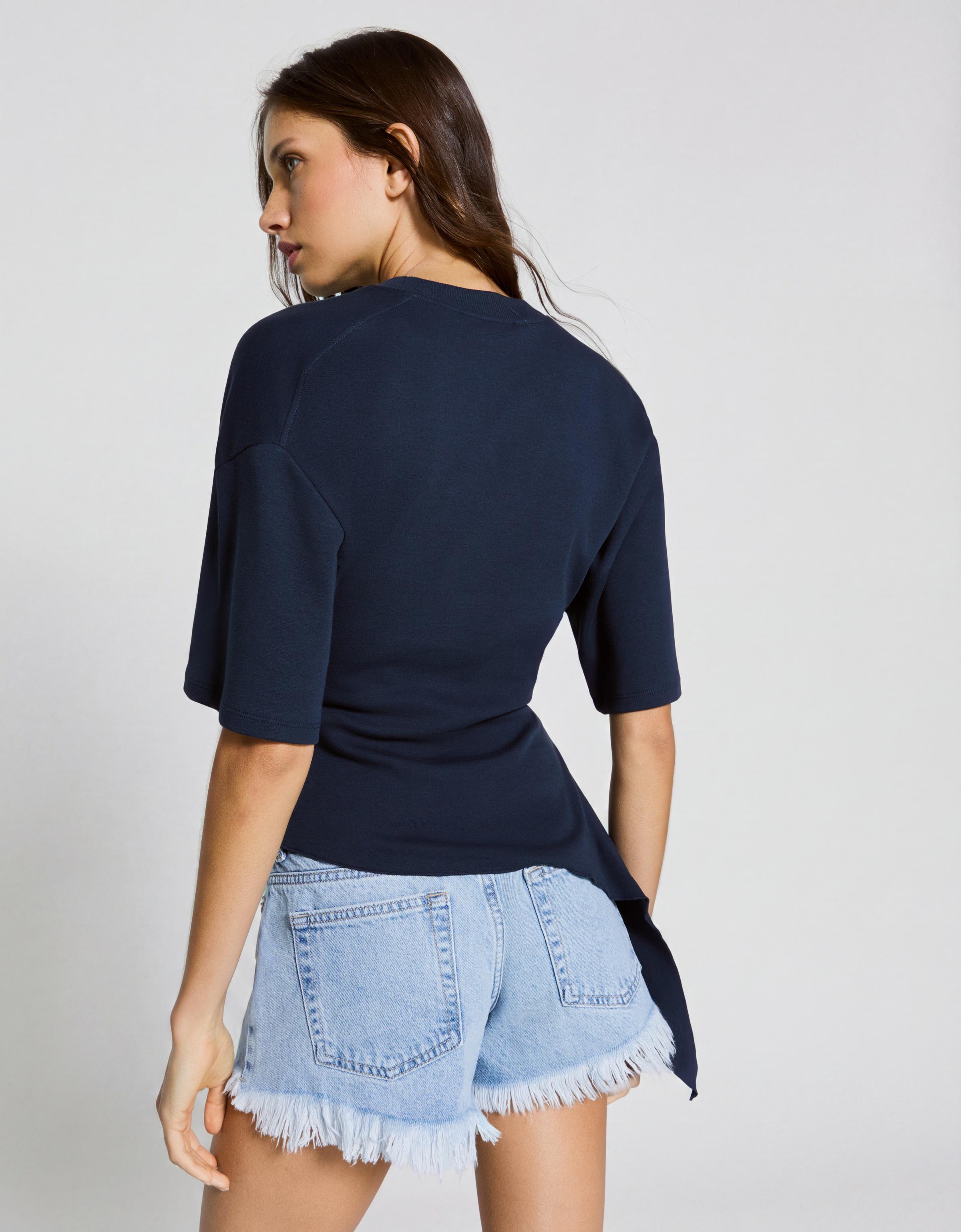 Denim mini shorts with frayed hem — Light blue