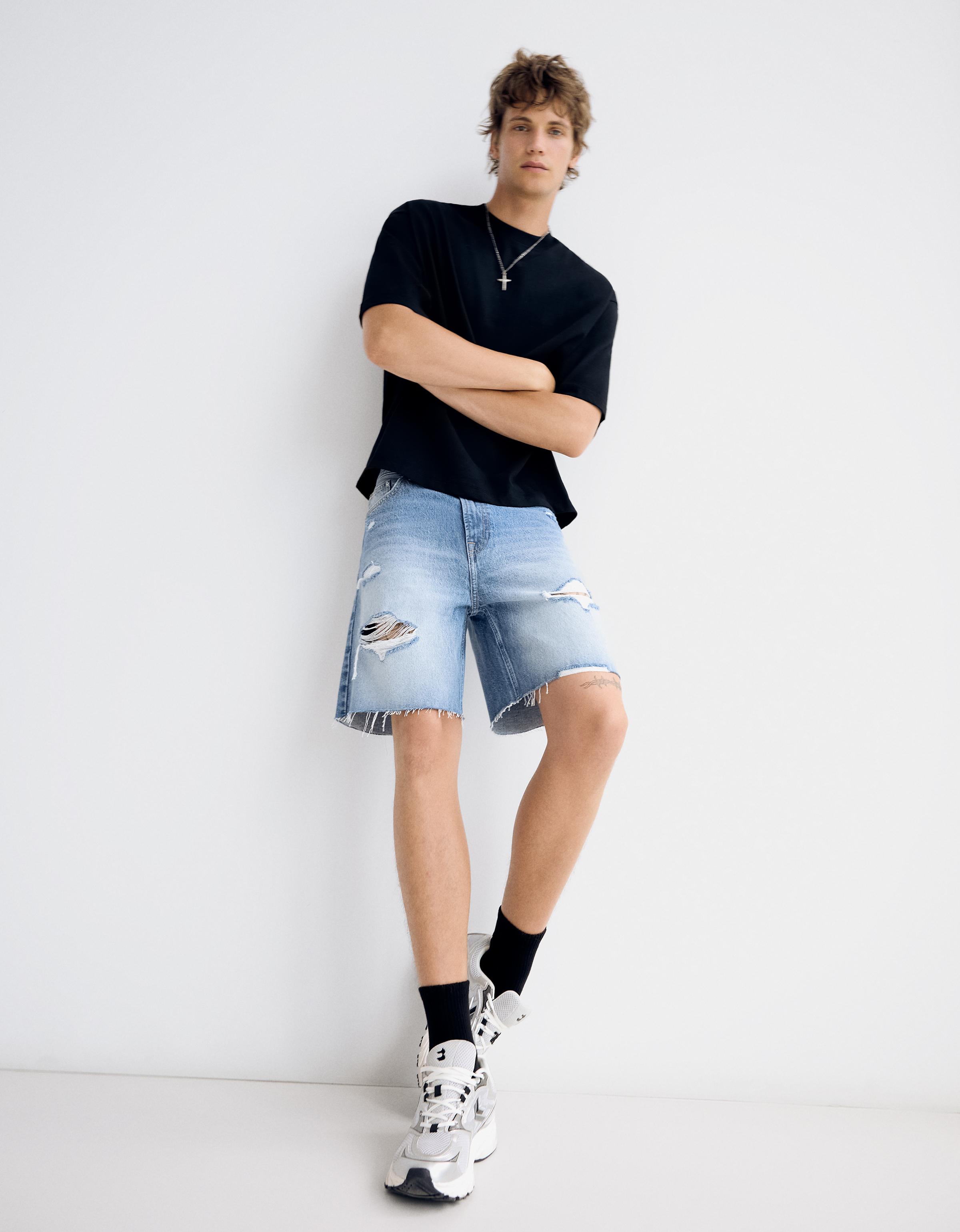 Ripped denim Bermuda shorts — Light blue