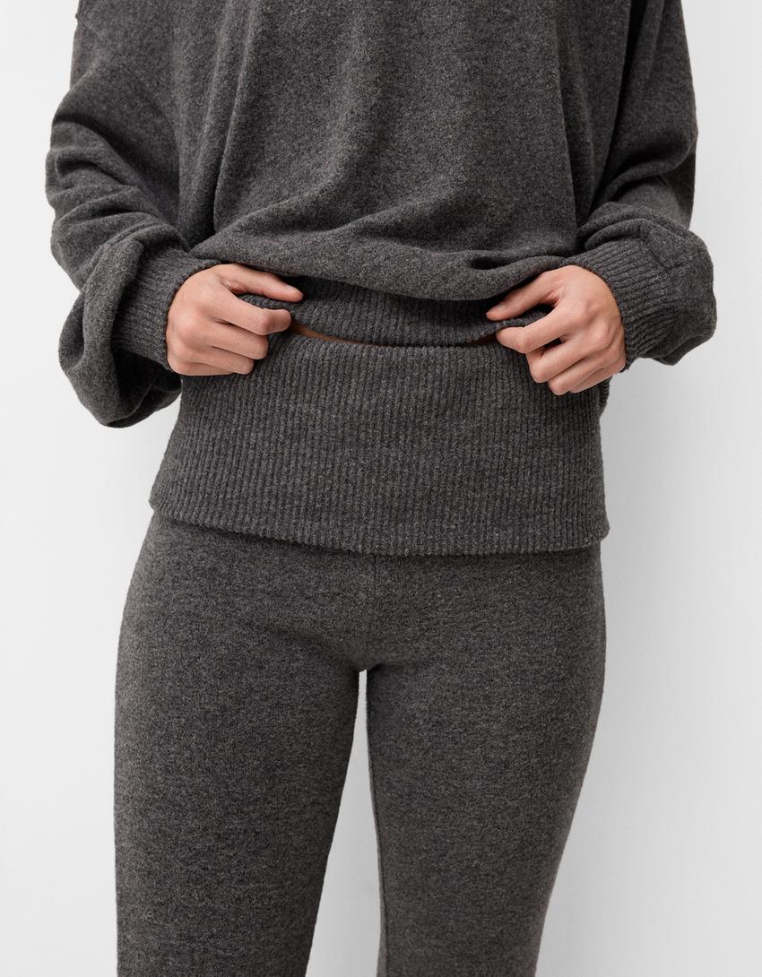 Flared trousers with fold-over waist