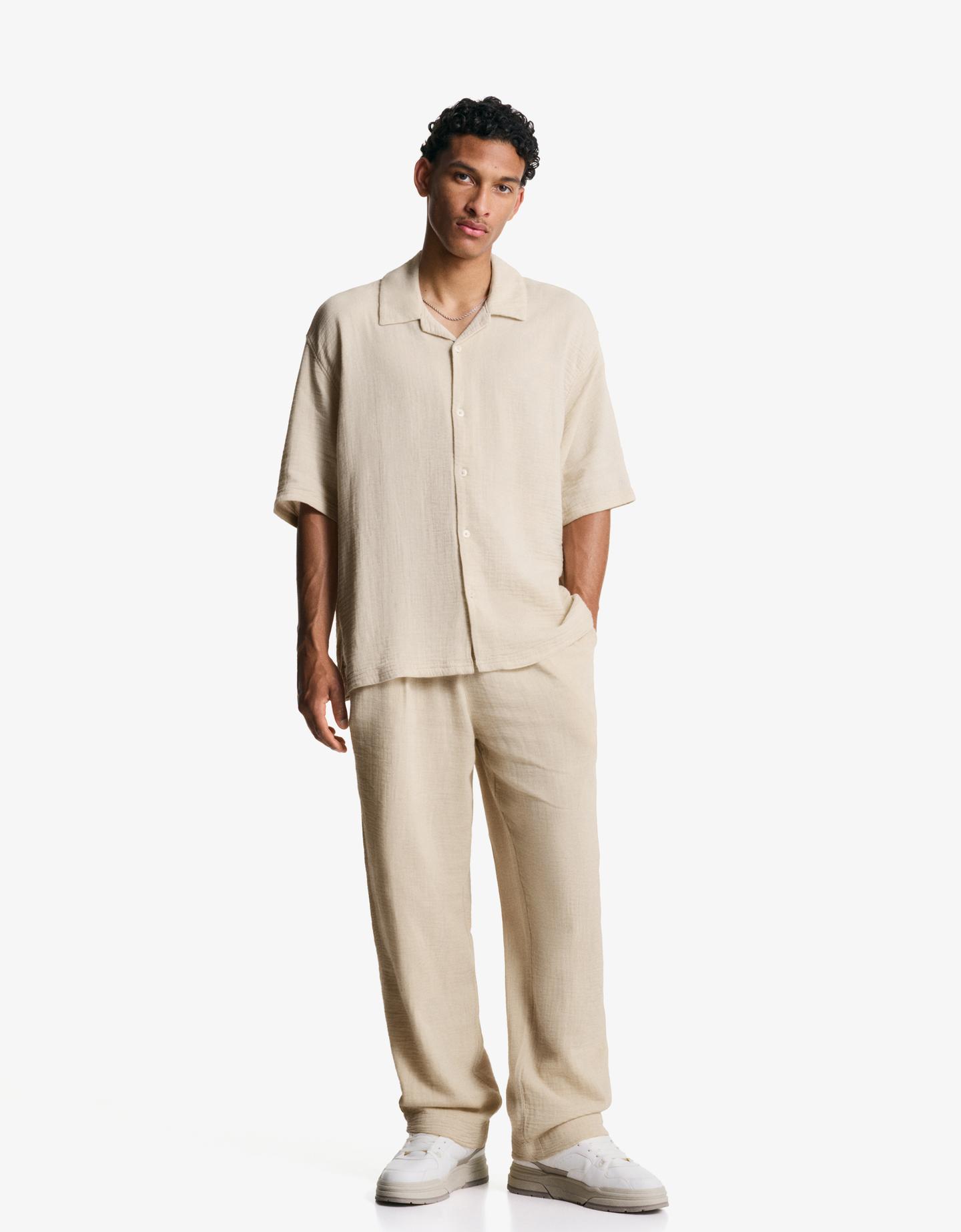 Bershka spodnie o kroju wide leg z krepy piaskowy