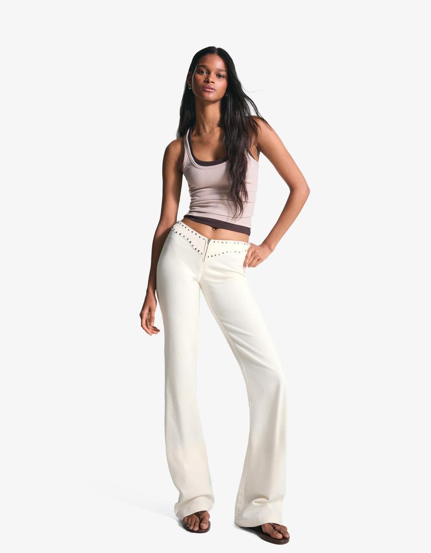 Pantaloni con borchie in vita e cerniera-Bianco Roto-0