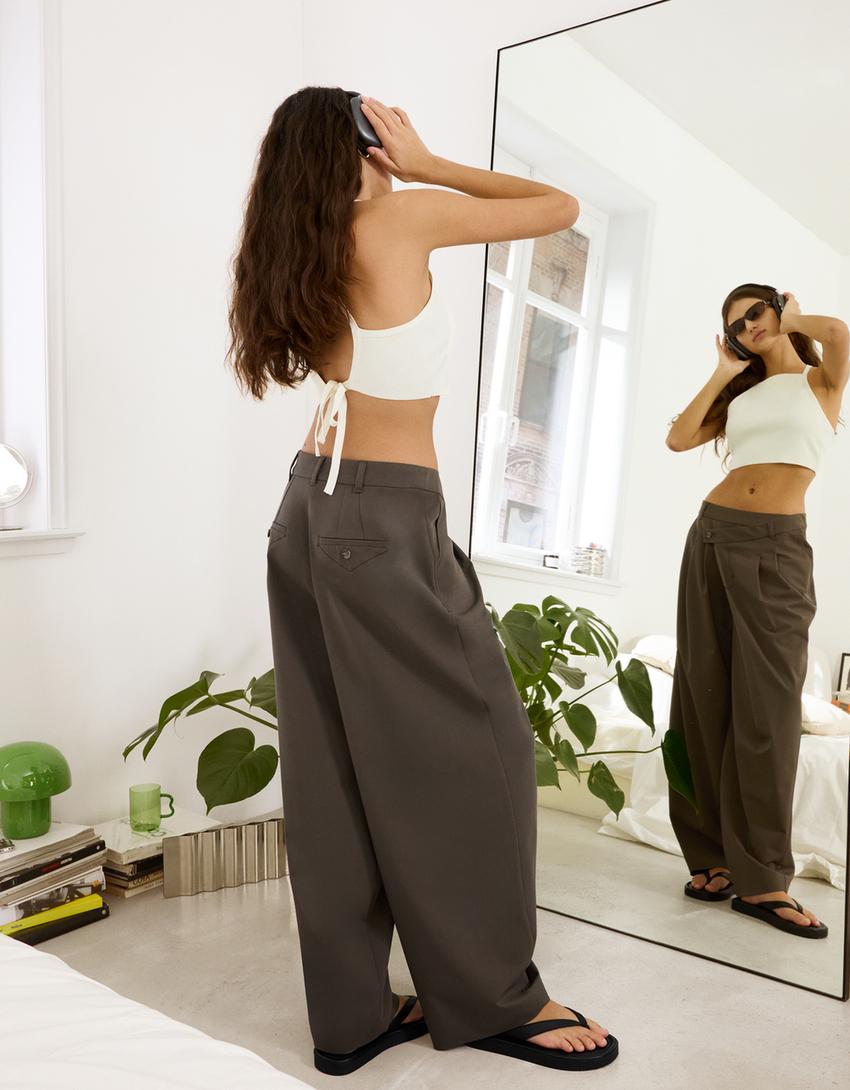 Tailored pants with crossover waistband