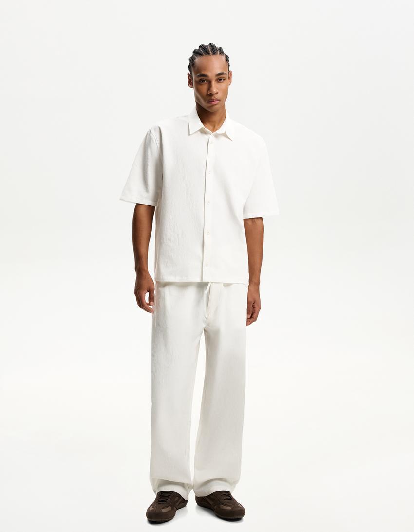 بنطلون رياضي فضفاض بليسيه-أبيض مطفي