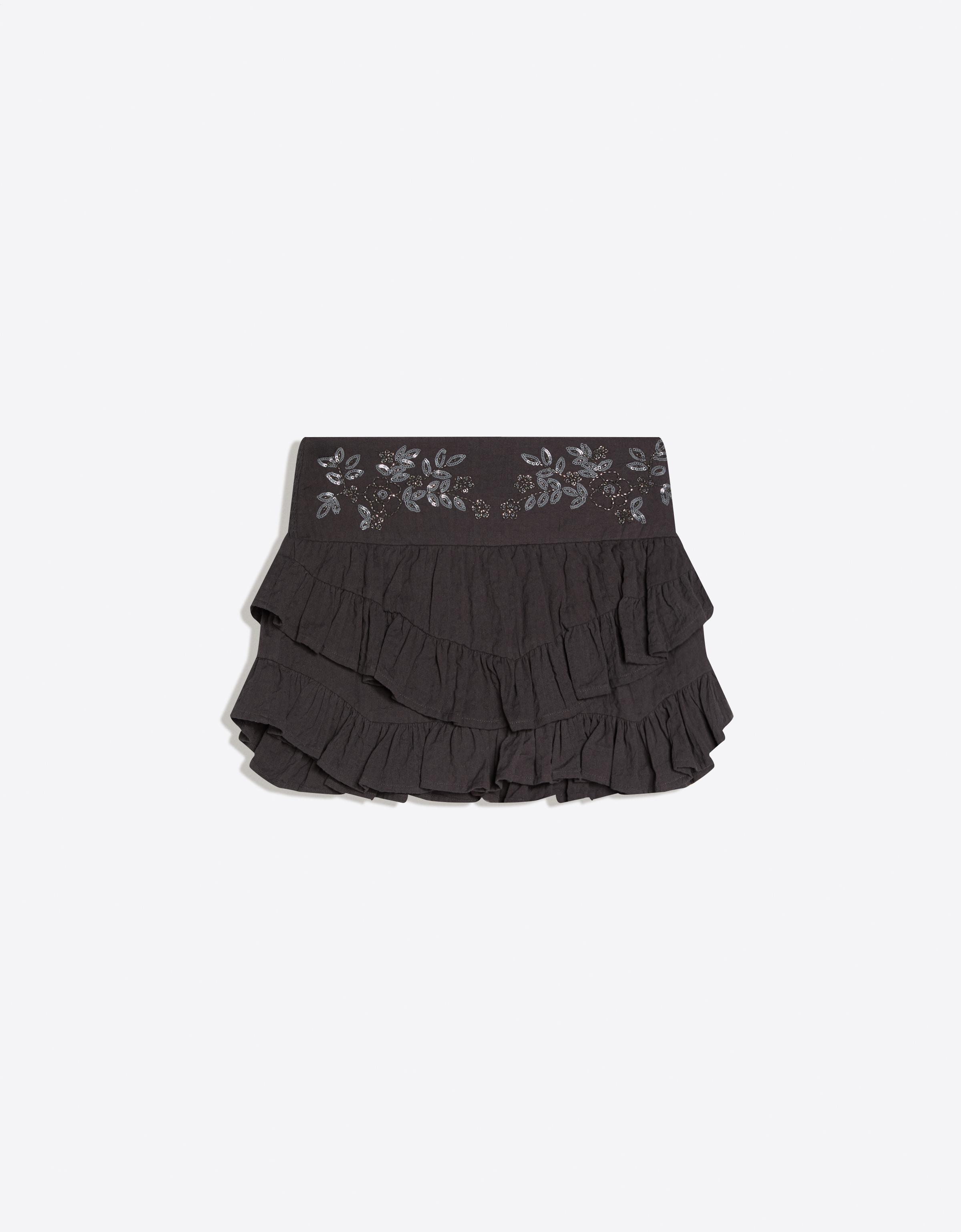 Mini skirt with ruffles and shimmery waistband