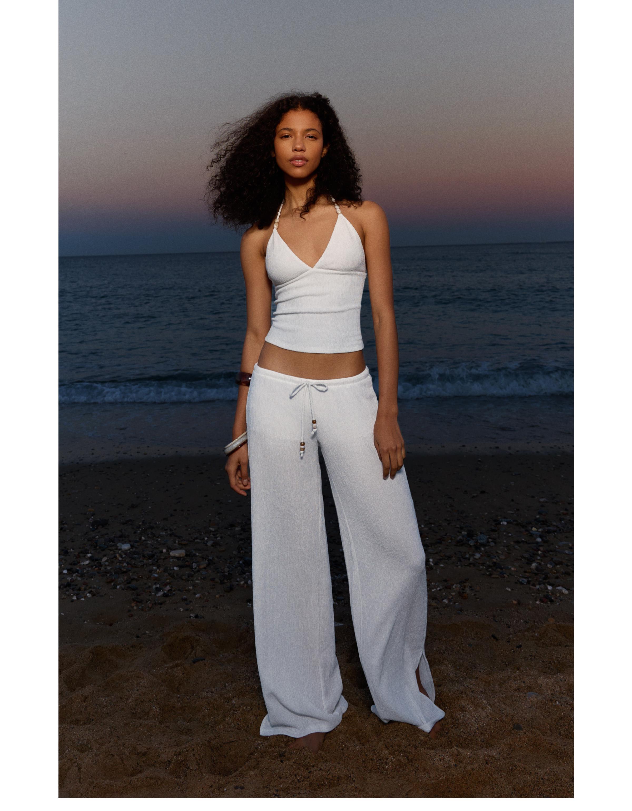 Wide-leg trousers with elasticated waist — Cream