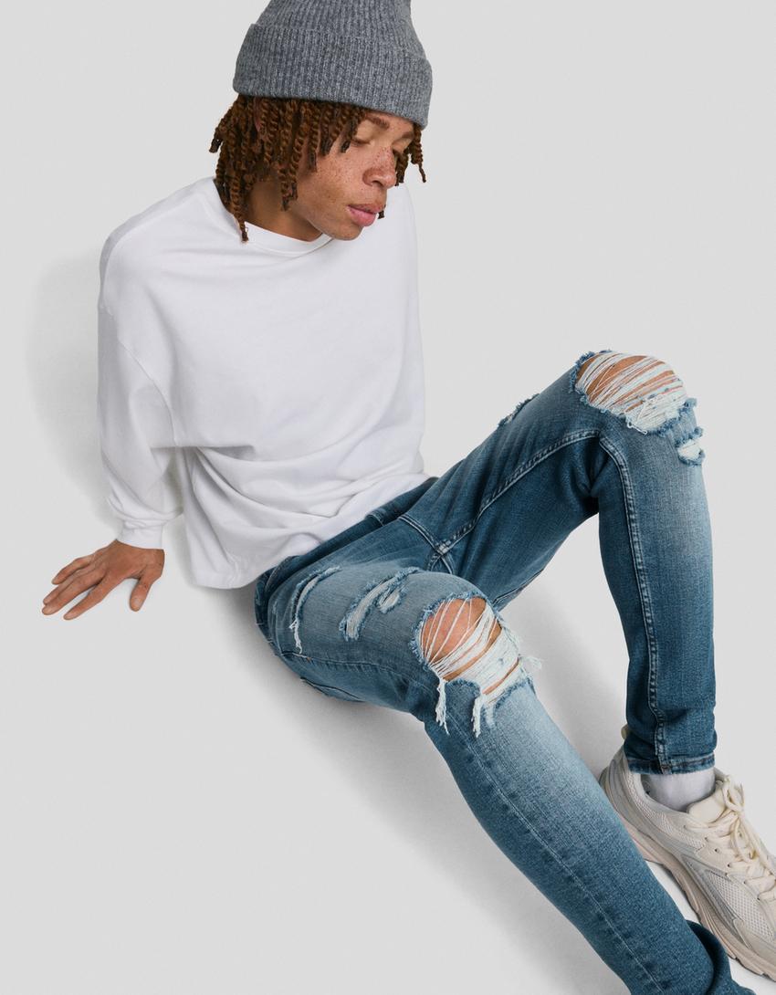 Jeans super skinny strappati-Azzurro Lavato