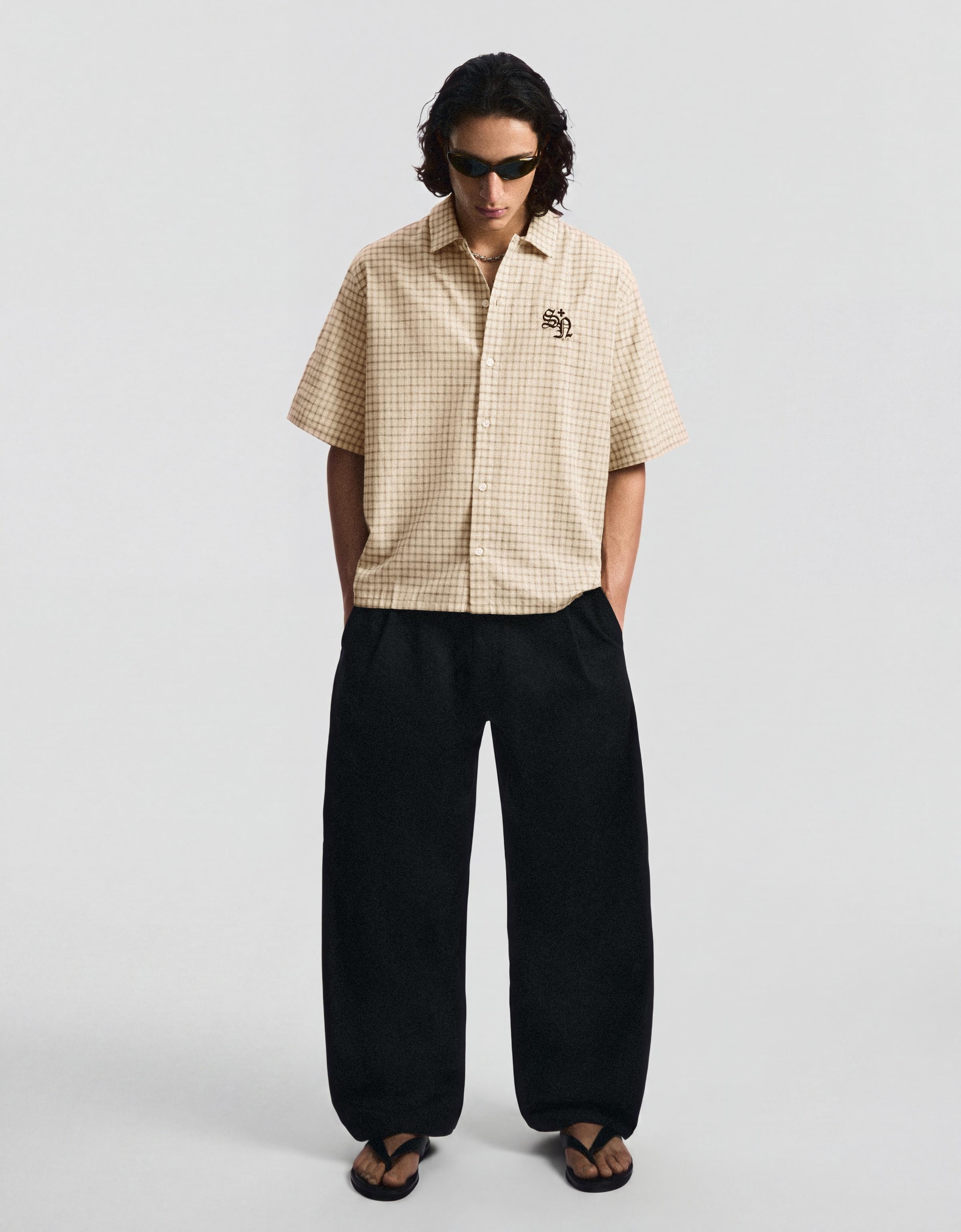 Darted barrel leg trousers — Black