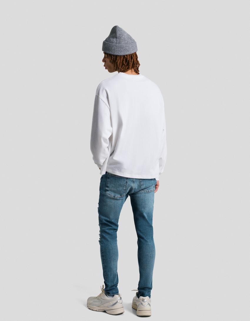 Jeans super skinny strappati-Azzurro Lavato