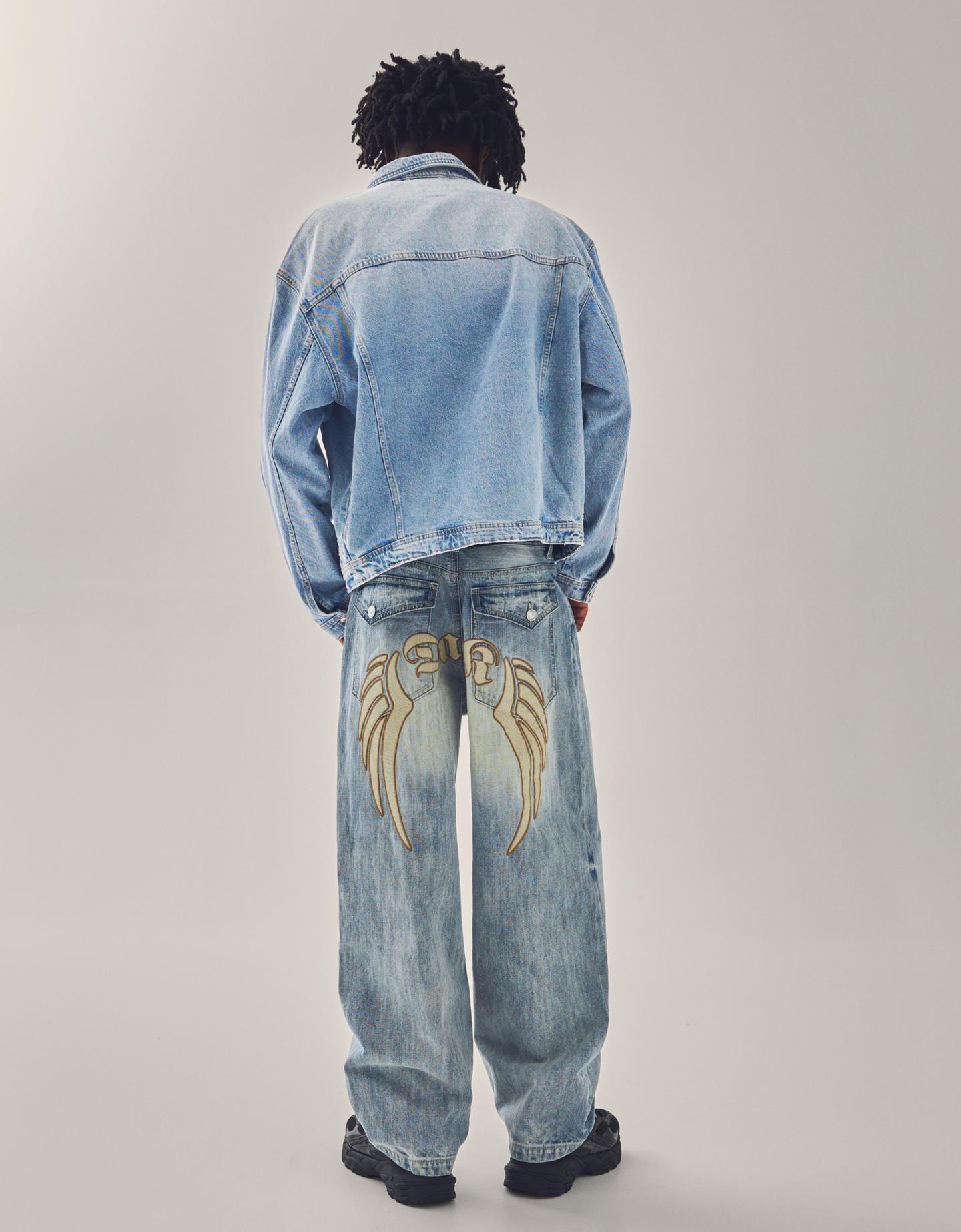 Bershka jeansy o kroju super baggy z haftem wyblakły niebieski