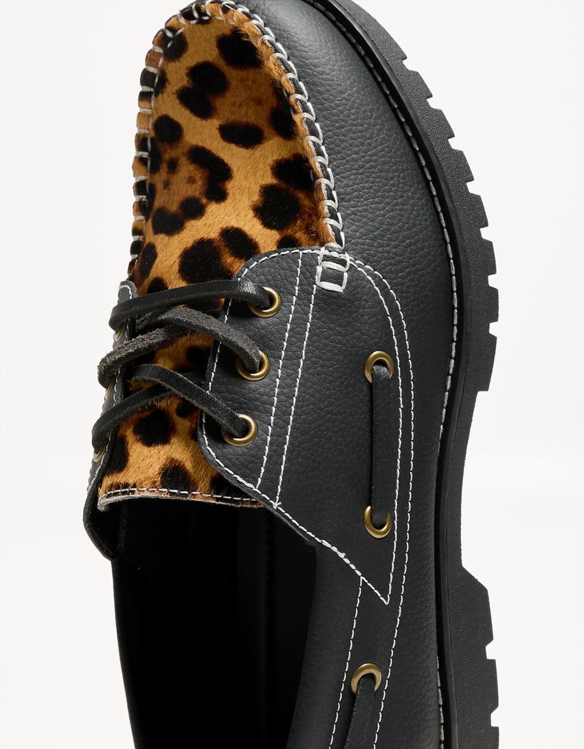 Animal print deck shoes