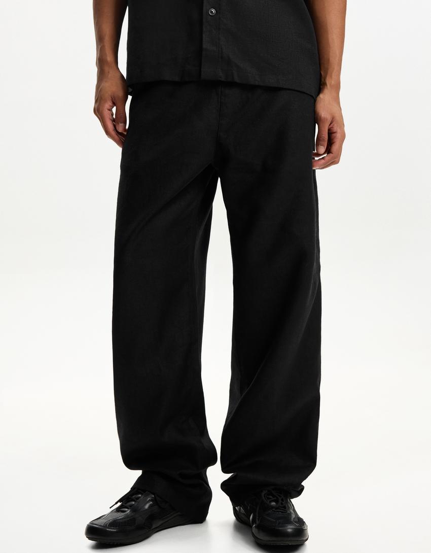 بنطلون رياضي بمزيج كتاني وساق عريضة-أسود