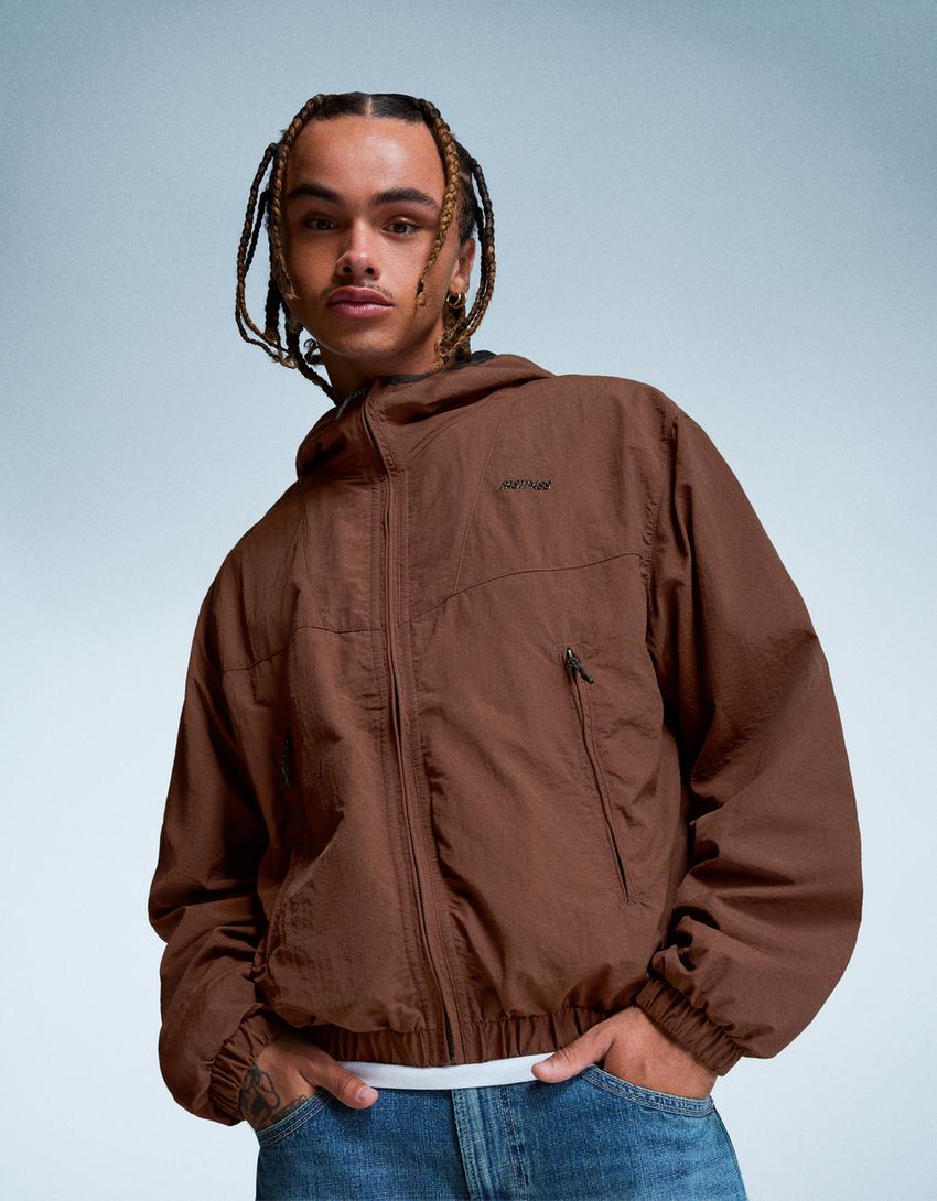 Hooded technical jacket