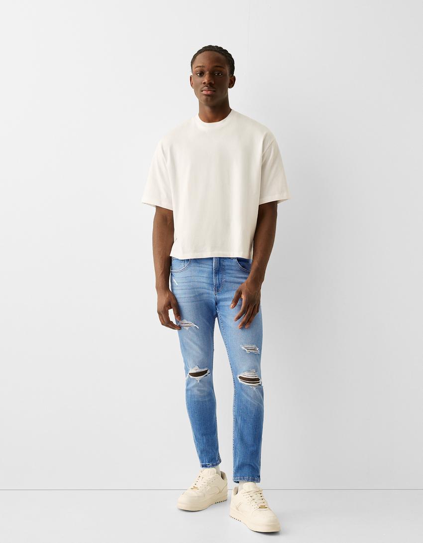 Ripped paint splatter skinny jeans - Jeans - Men | Bershka