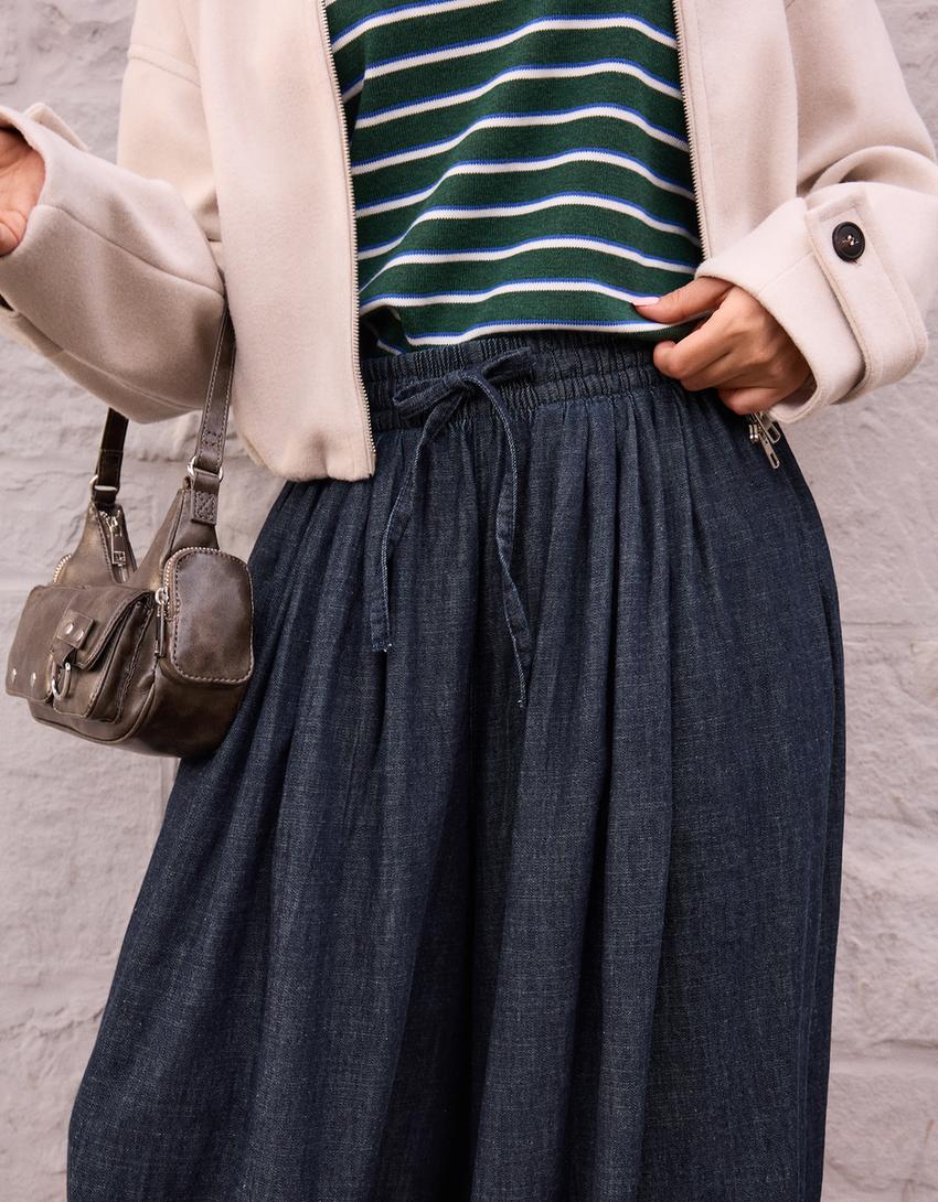 Pūsti džinsai su žemu juosmeniu-Tamsiai mėlyna