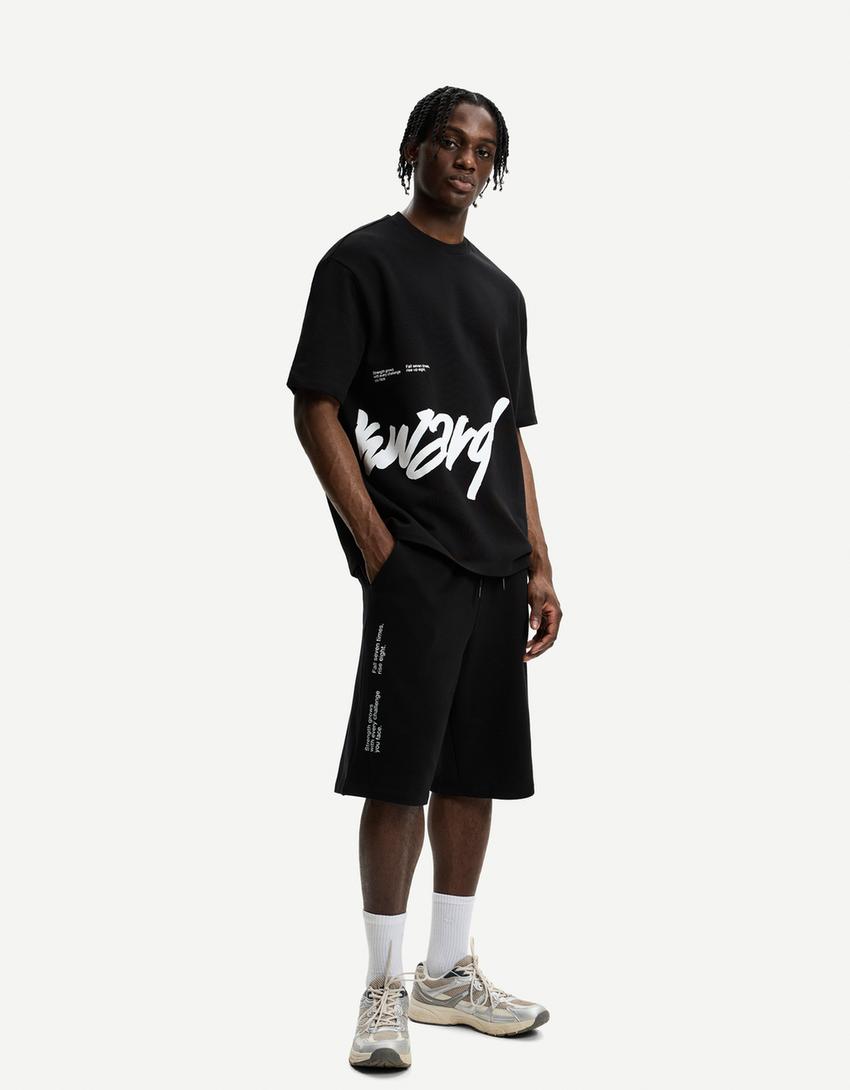 Plush Bermuda shorts with print-Black