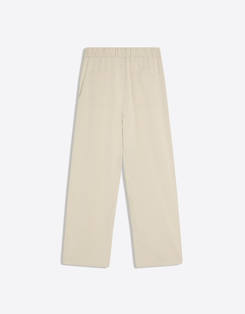 Calças super baggy fit fluidas com pinças-Pedra