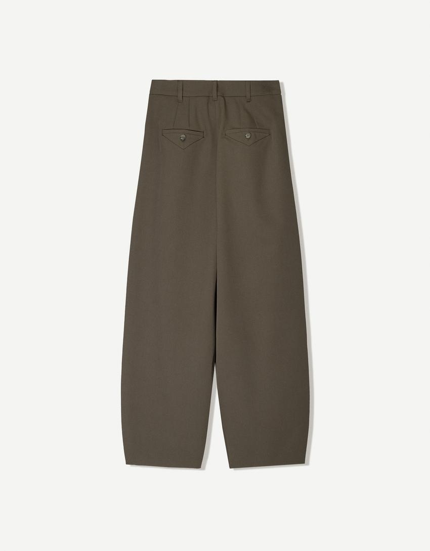 Tailored pants with crossover waistband