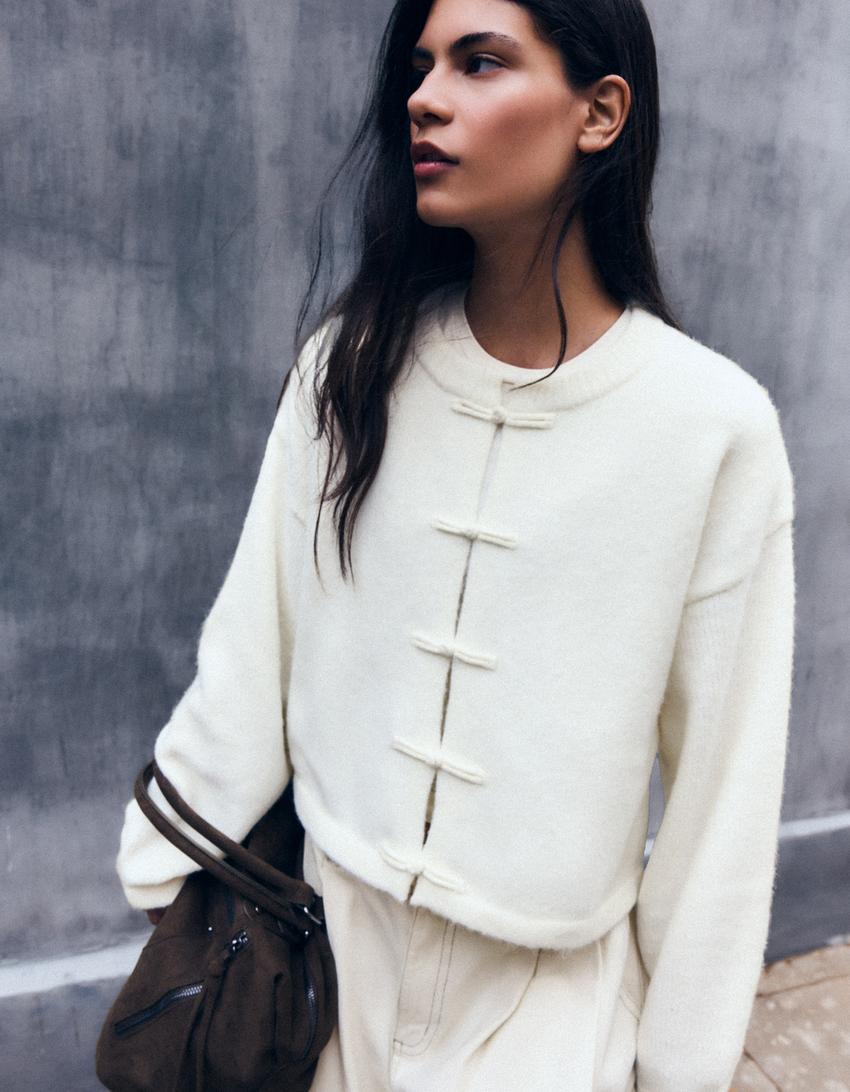 Crew neck cardigan with clasp fasteners-Cream