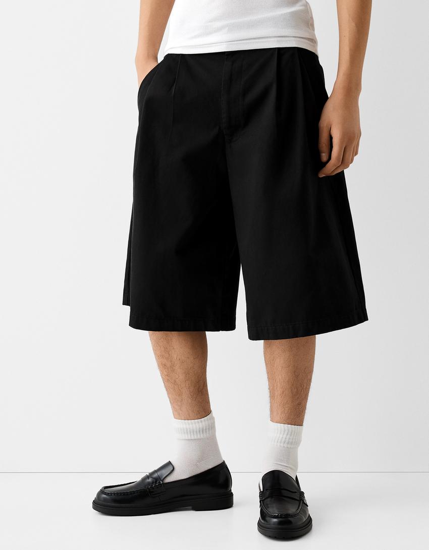 برمودا من مزيج قطني بساق عريضة وثنيات أمامية-أسود-1