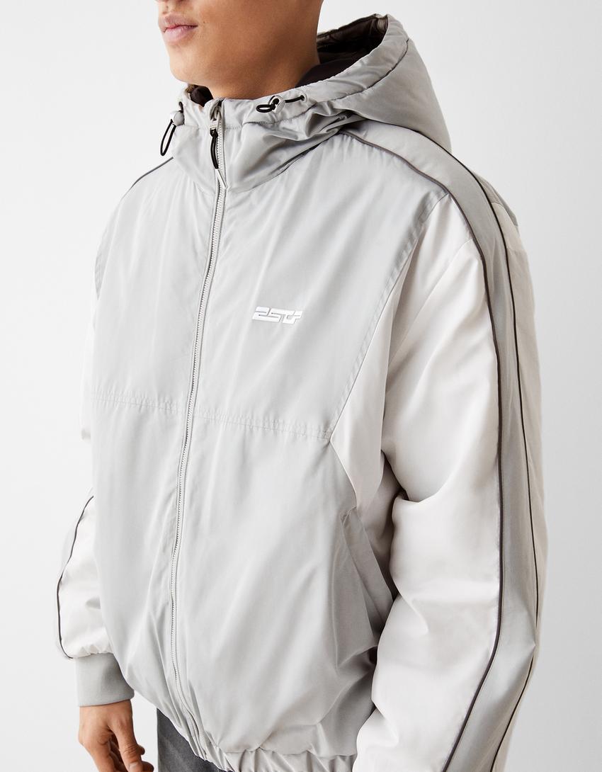 جاكيت تقني بكتل لونية وغطاء رأس-رمادي-2