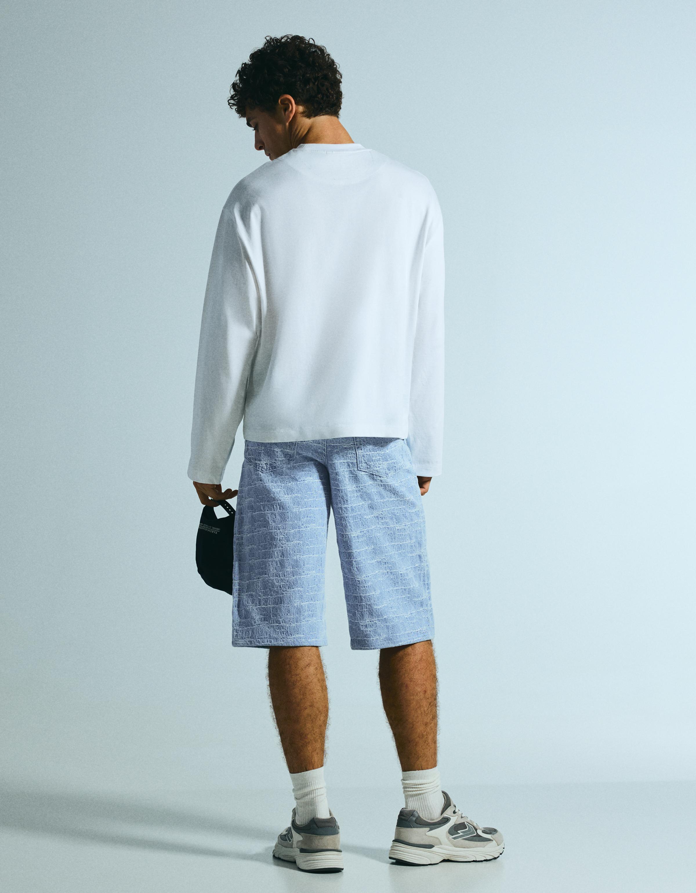 Super baggy textured denim Bermuda shorts — Light blue