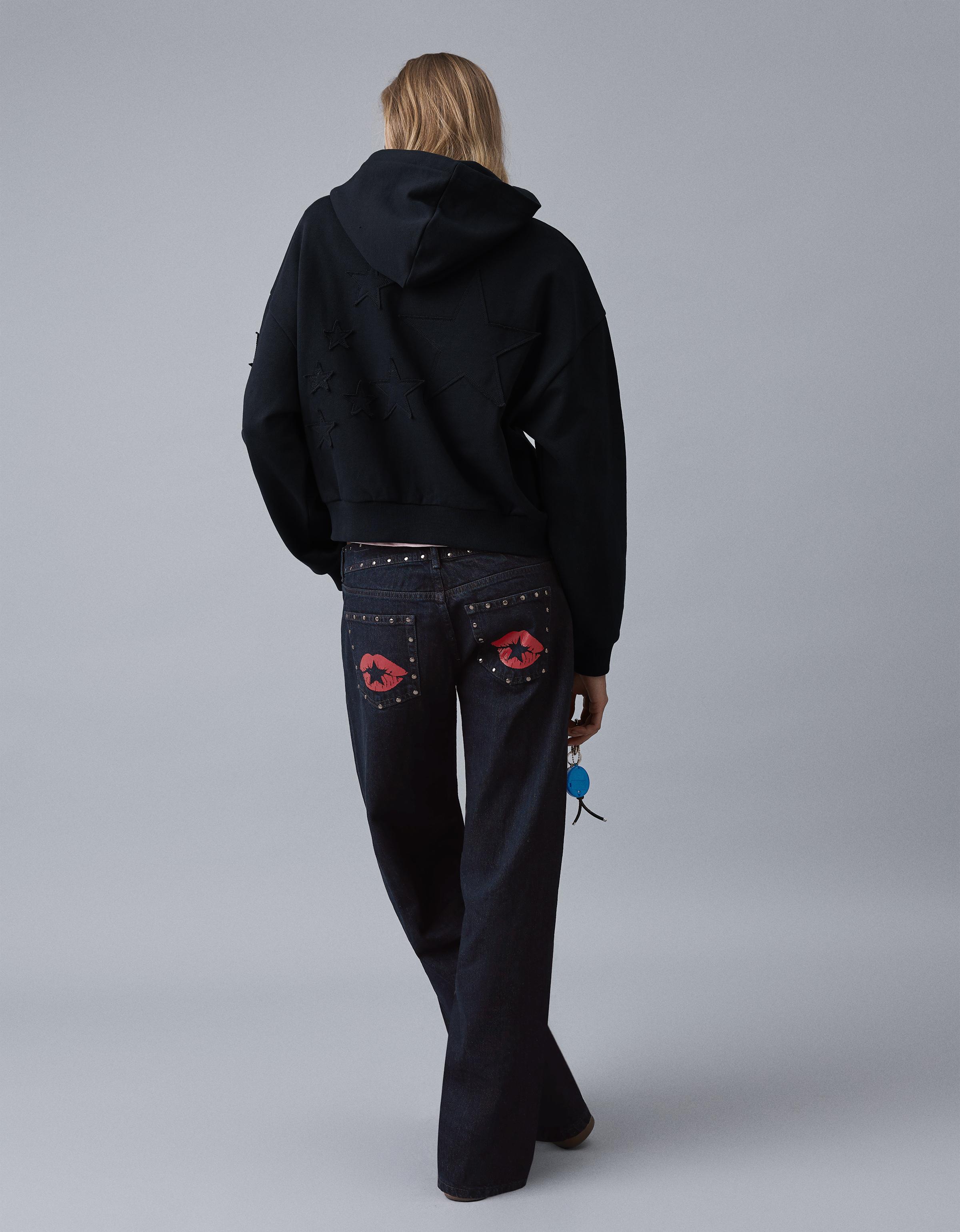 Low-rise baggy studded jeans