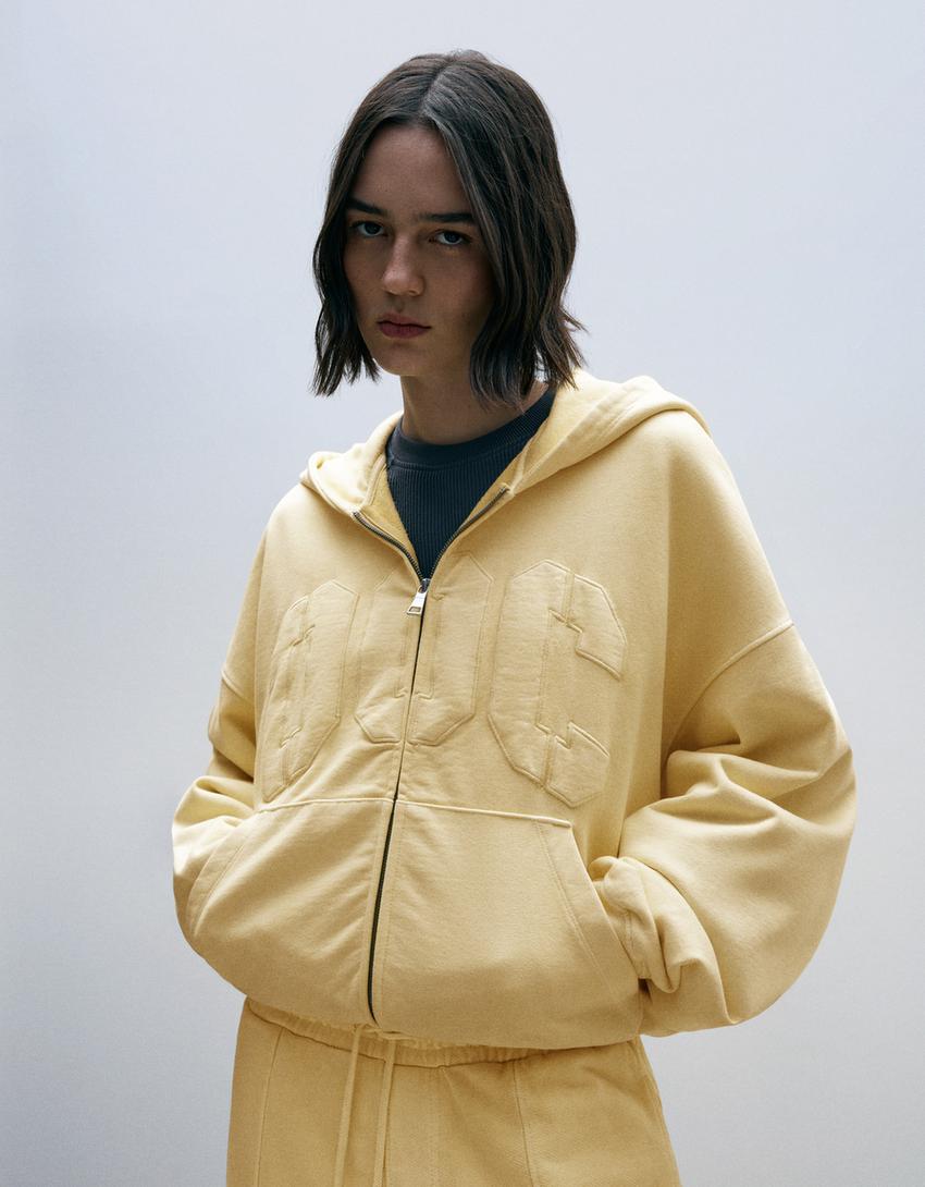 Sudadera capucha parche OUT OF CORE