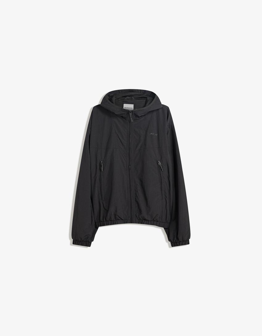 Hooded technical jacket