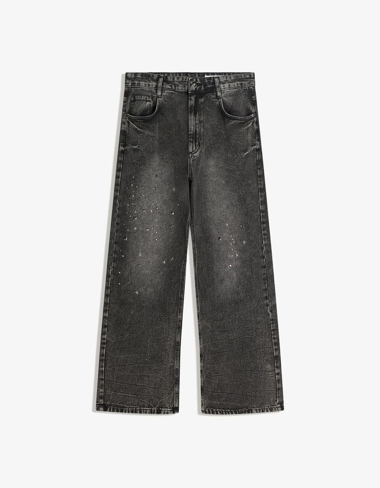 Pantalón flare tachas