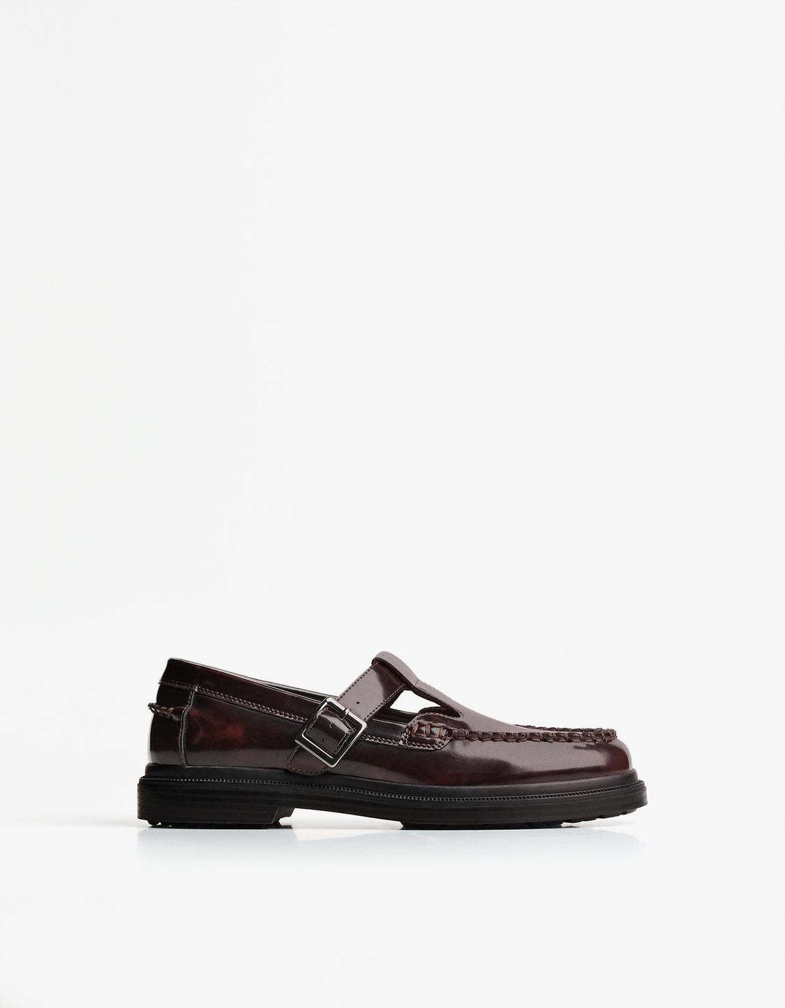 Shoes with buckled strap