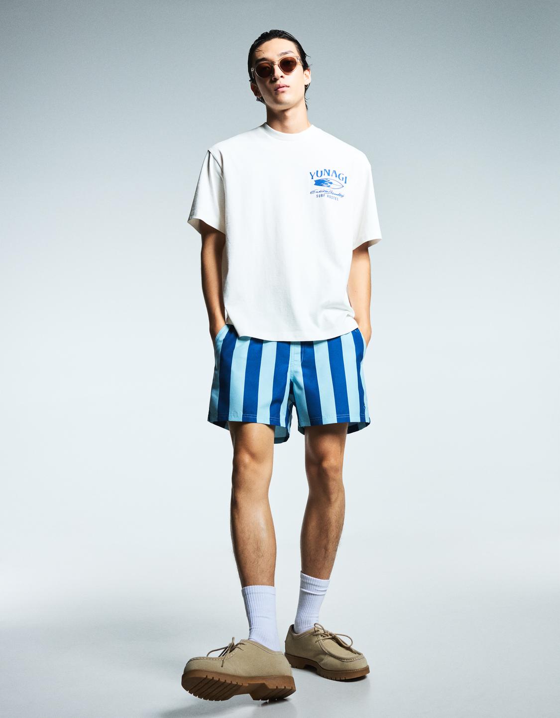 Striped print swimming trunks