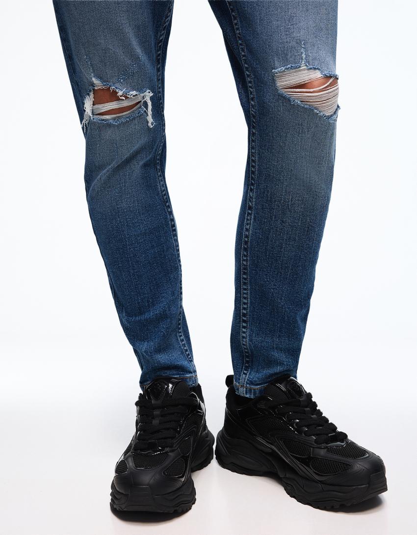 Carrot fit jeans met scheuren-Blauw