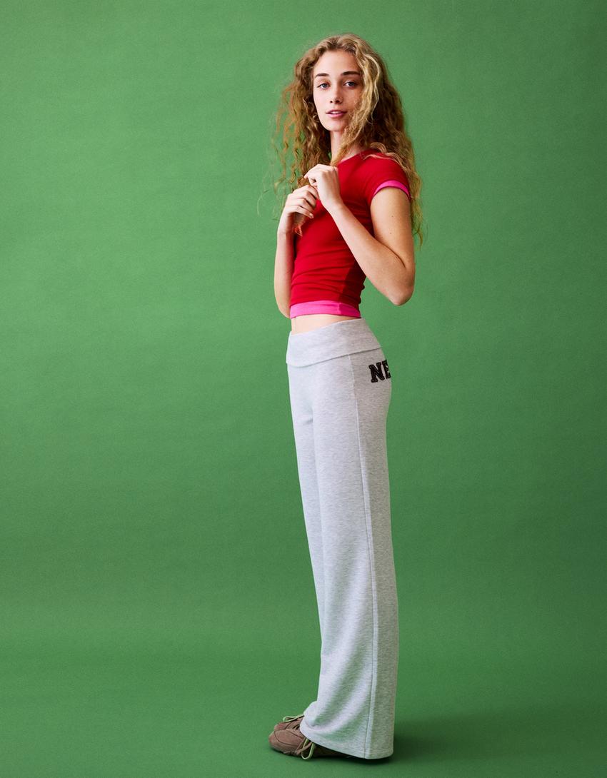 Flared plush trousers with patch-Grey