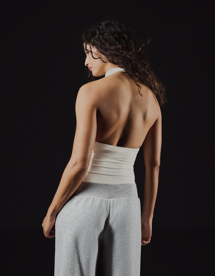 Halterneckbody-Krämfärgad