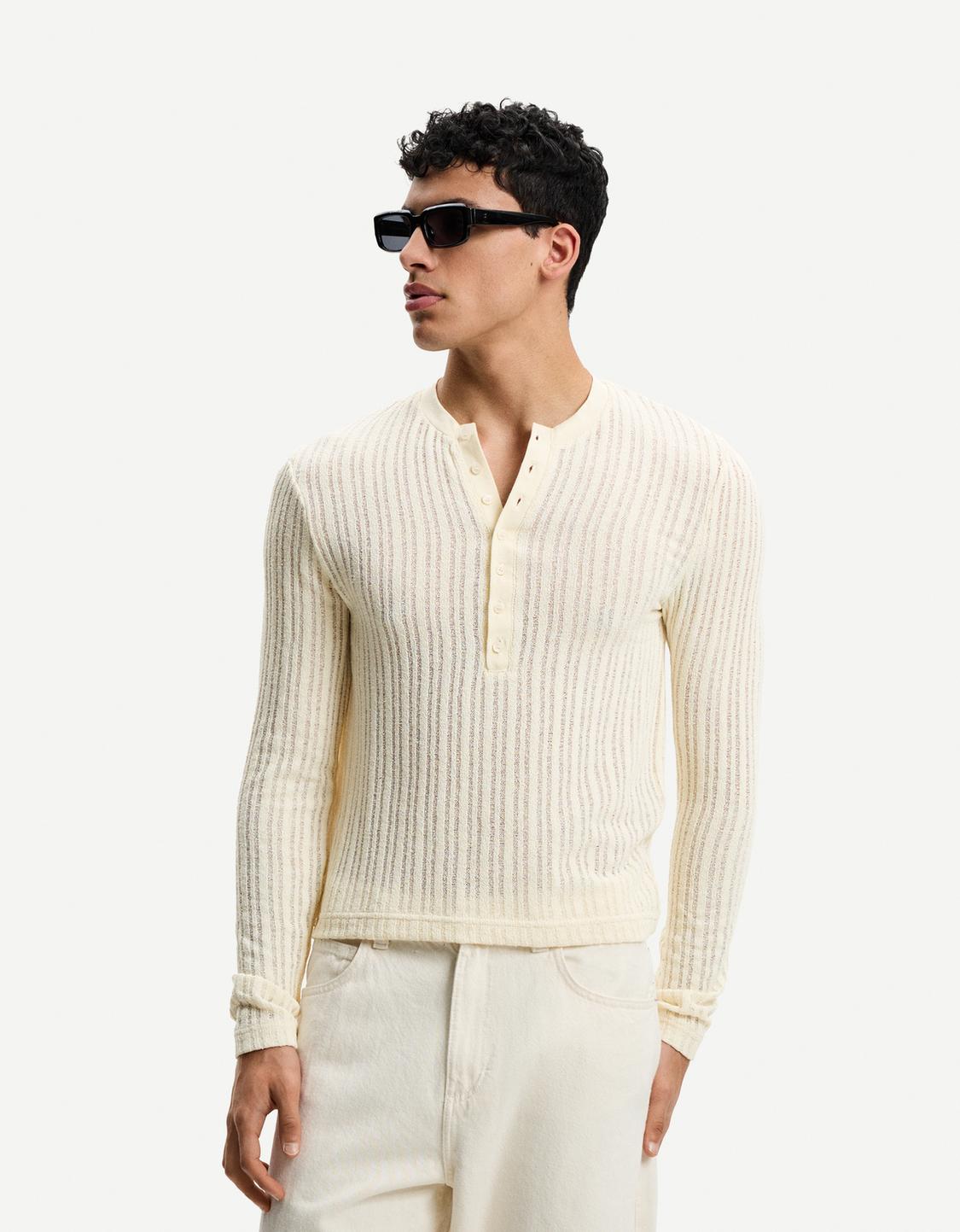 Openwork sweater with buttons