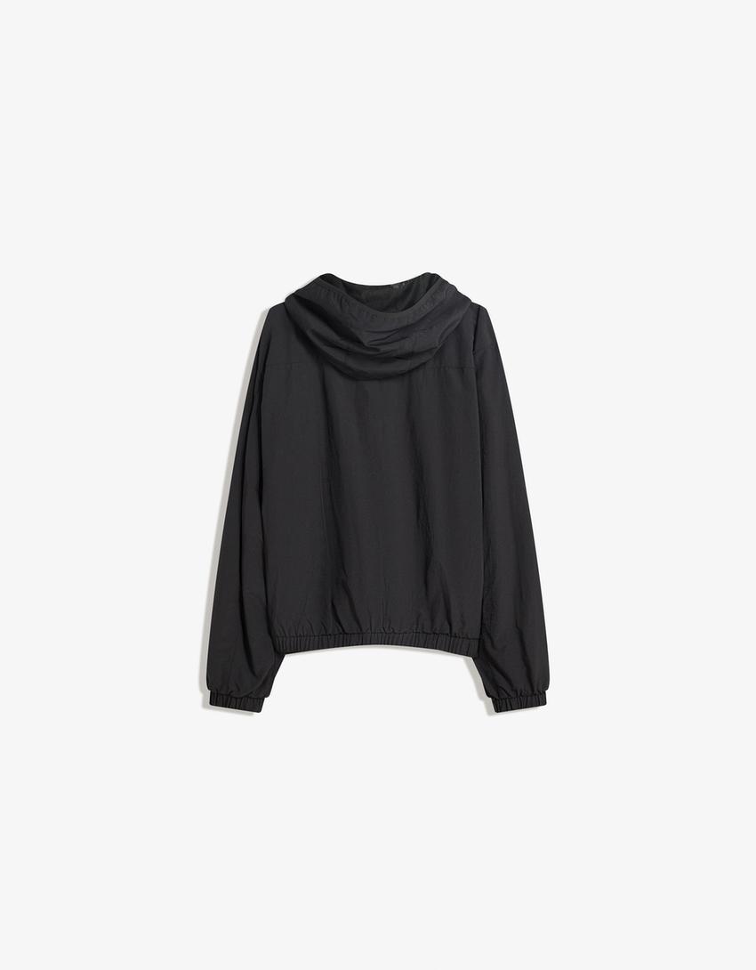 Cazadora técnica capucha-Negro