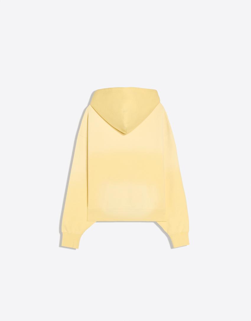 Hoodie in Washed-Optik mit Print-Gelb