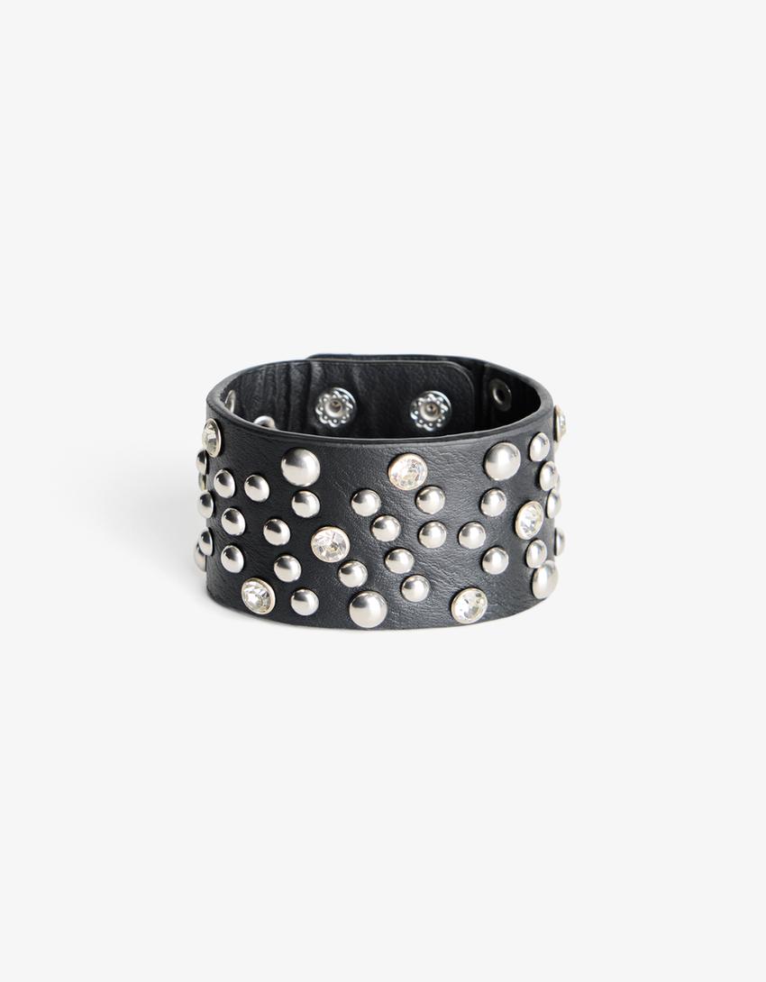 Pulseira com tachas em polipele-Dourado