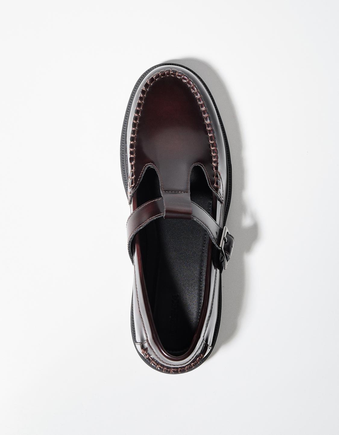 Shoes with buckled strap