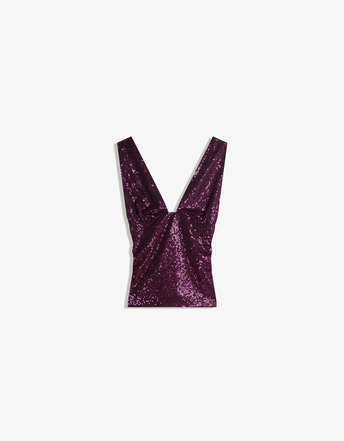 Fitted shimmery top with gathering