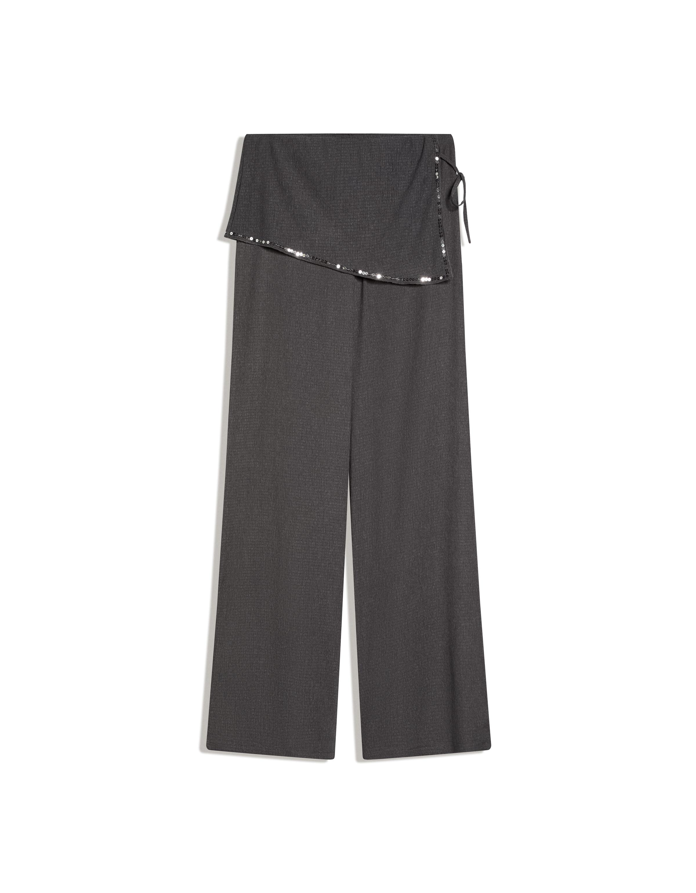 Trousers with sequin overskirt