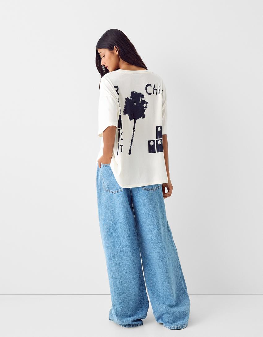 تيشرت بشعار ريد هوت تشيلي بيبرز وأكمام قصيرة-كريمي-1