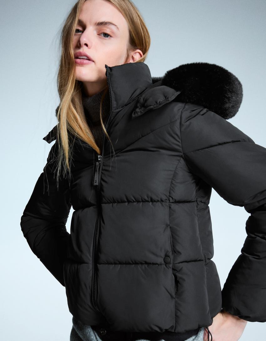 Water-repellent puffy jacket with fur hood-Black